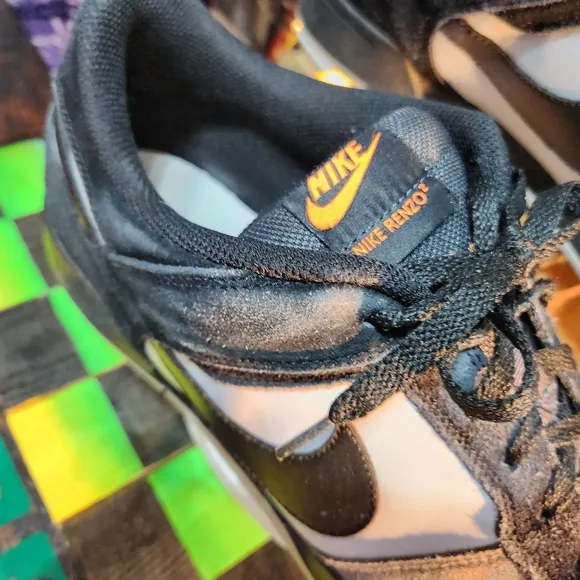 Black and White Sneakers with Orange Accents