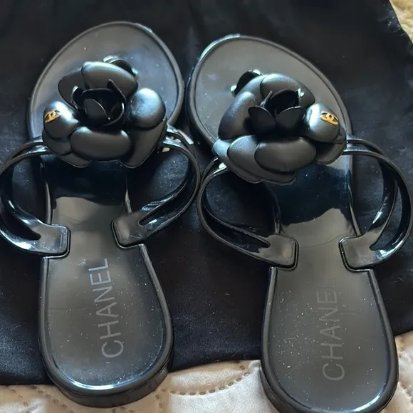 CHANEL Black Sandals with Camellia Embellishment