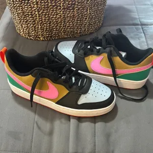 Colorful Low-Top Sneakers with Pink Swoosh