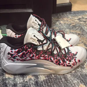 Dynamic White and Black Sneakers with Red Accents