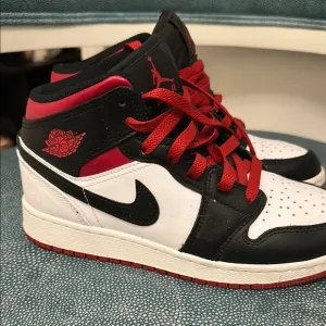 Jordan 1 Black and Red High-Top Sneakers