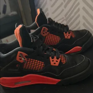 jordan 4 red thunders slightly used