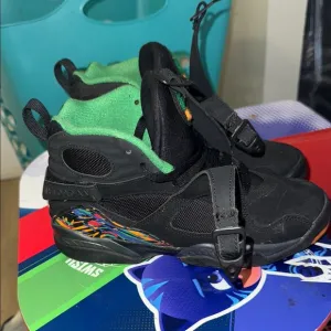 Jordan Black and Green Sneakers with Cross-Strap Design