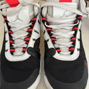 Jordan Black and White Sneakers with Textured Upper and Contrasting Midsole