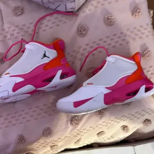 Jordan Pink and Orange Sneakers with Bold Color Blocking