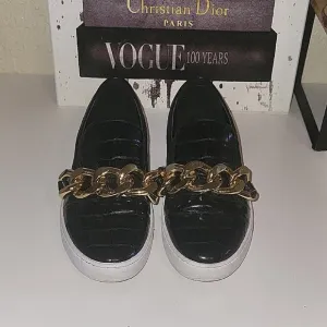 MICHAEL Michael Kors Black Embossed Crocodile Print Sneakers with Gold C…