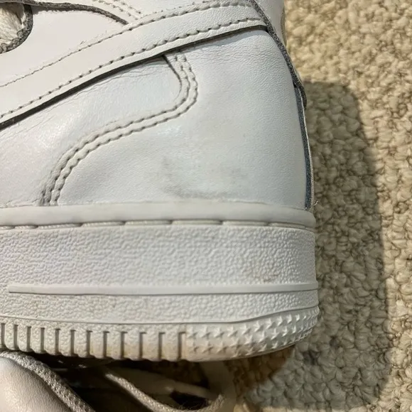 Nike Air Force 1 High Top Leather Sneakers.