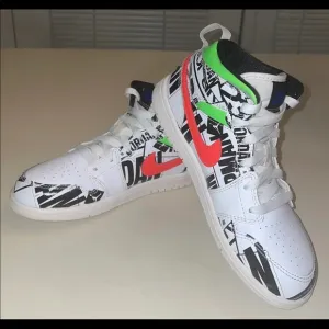 Nike Air Jordan 1 Mid Over-Print Logos Sneakers