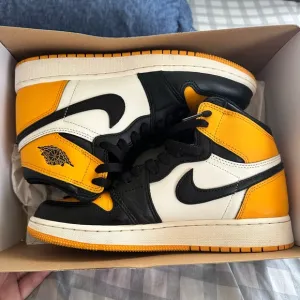 Nike Air Jordan 1 Mid Yellow and Black Sneakers
