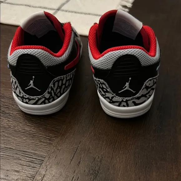Nike Black and Red Sneakers with Blue Swoosh