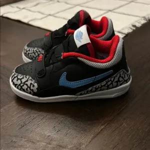 Nike Black and Red Sneakers with Blue Swoosh