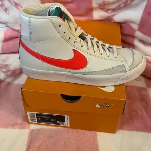 Nike High-Top Sneakers with Red Swoosh