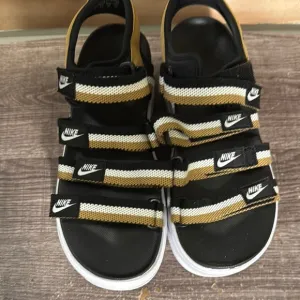 Nike women Black and Gold Sandals