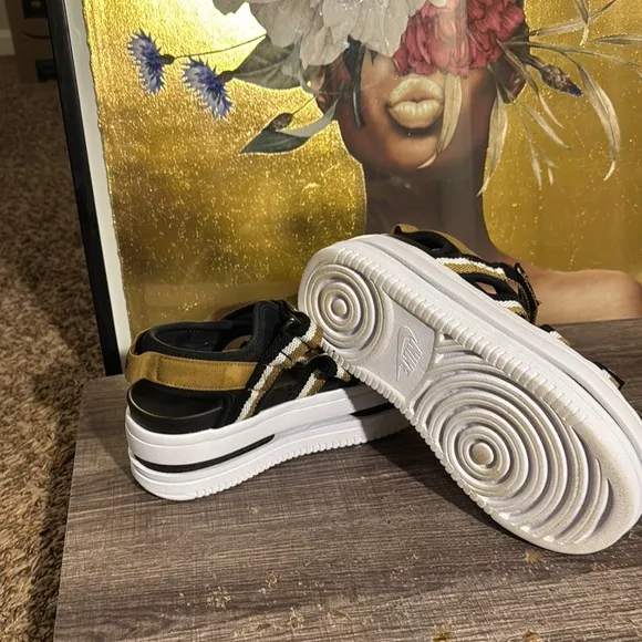 Nike women Black and Gold Sandals