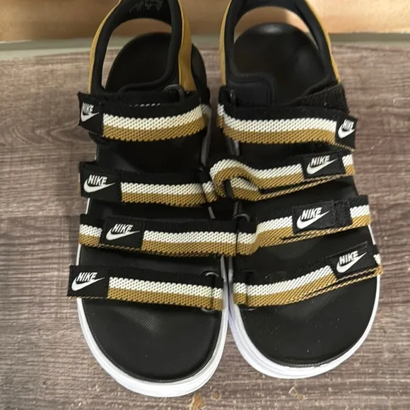 Nike women Black and Gold Sandals