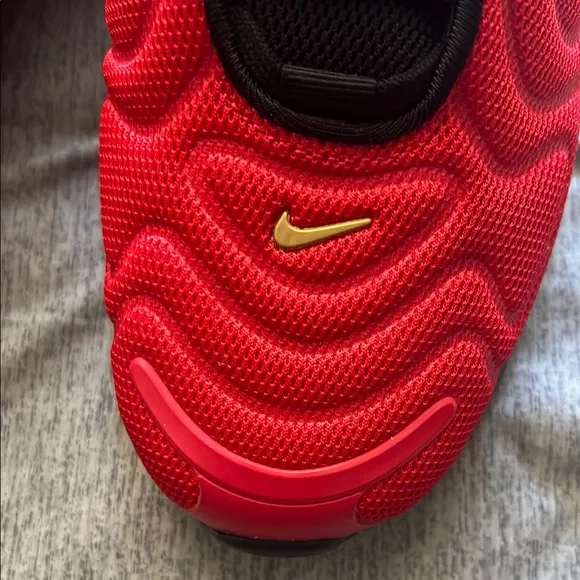 Red Nike Sneakers with Black and Gold Accents
