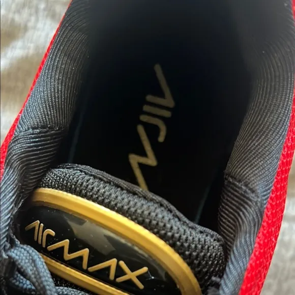 Red Nike Sneakers with Black and Gold Accents