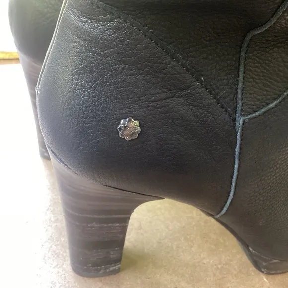 Ugg black leather heeled boots with strap detail, size 9