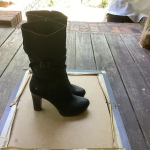 Ugg black leather heeled boots with strap detail, size 9
