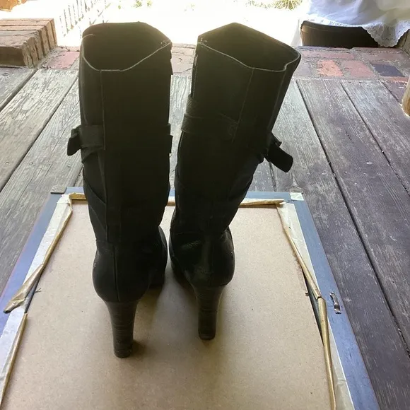 Ugg black leather heeled boots with strap detail, size 9